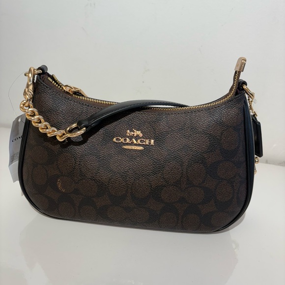 Coach Handbags - Coach Black and Brown Shoulder Bag with Gold Accents